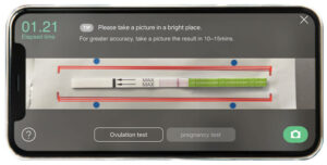 Ta et bilde med Smile Reader-appen. Match de røde boksene på posen med boksene i appen.